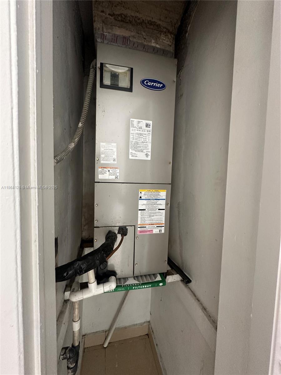 627 Southwest 3rd Street, Unit 4 Miami, FL 33130 - Photo 9 of 12 a room with storage and utility