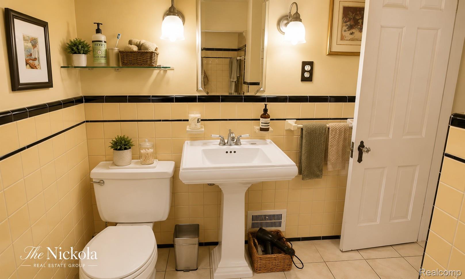 515 Barrington Road Detroit, MI 48215 - Photo 19 of 27 Bathroom with a shower with shower curtain, tile patterned flooring, tile walls, and a wainscoted wall