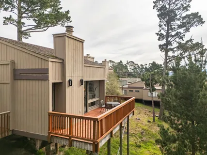 a view of balcony with furniture