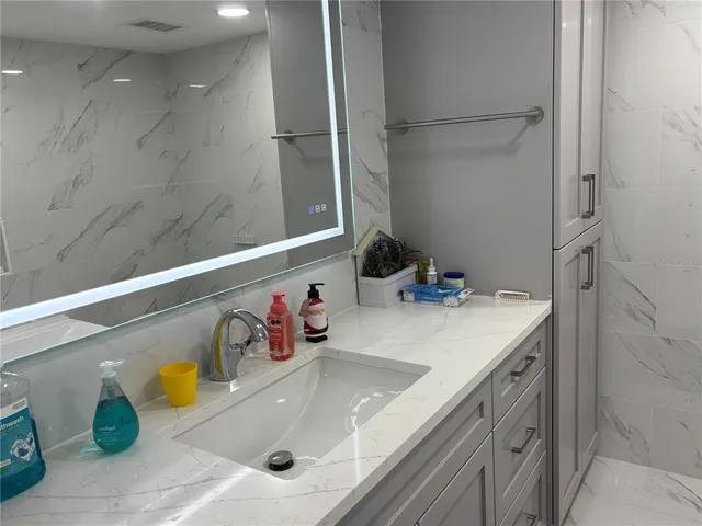 a bedroom with bed and furniture