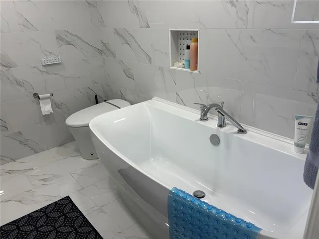 a bedroom with a bed and furniture