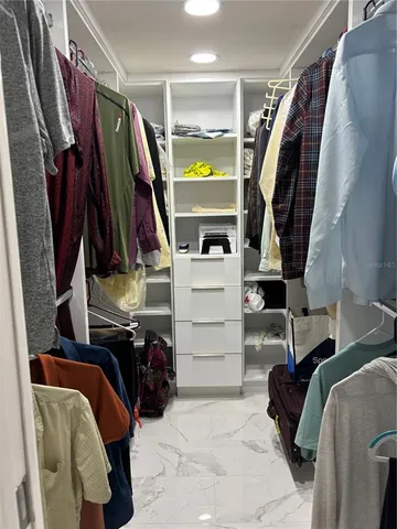 a kitchen with stainless steel appliances a refrigerator and cabinets