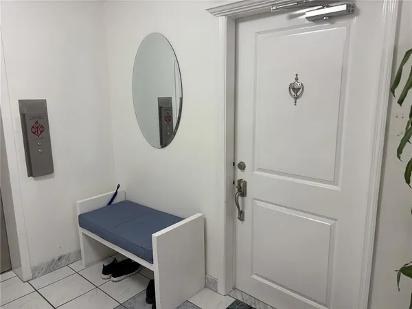 a view of a lake with a tree in the background