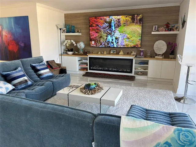 a bedroom with a bed a bookshelf and a shelf with wooden floor