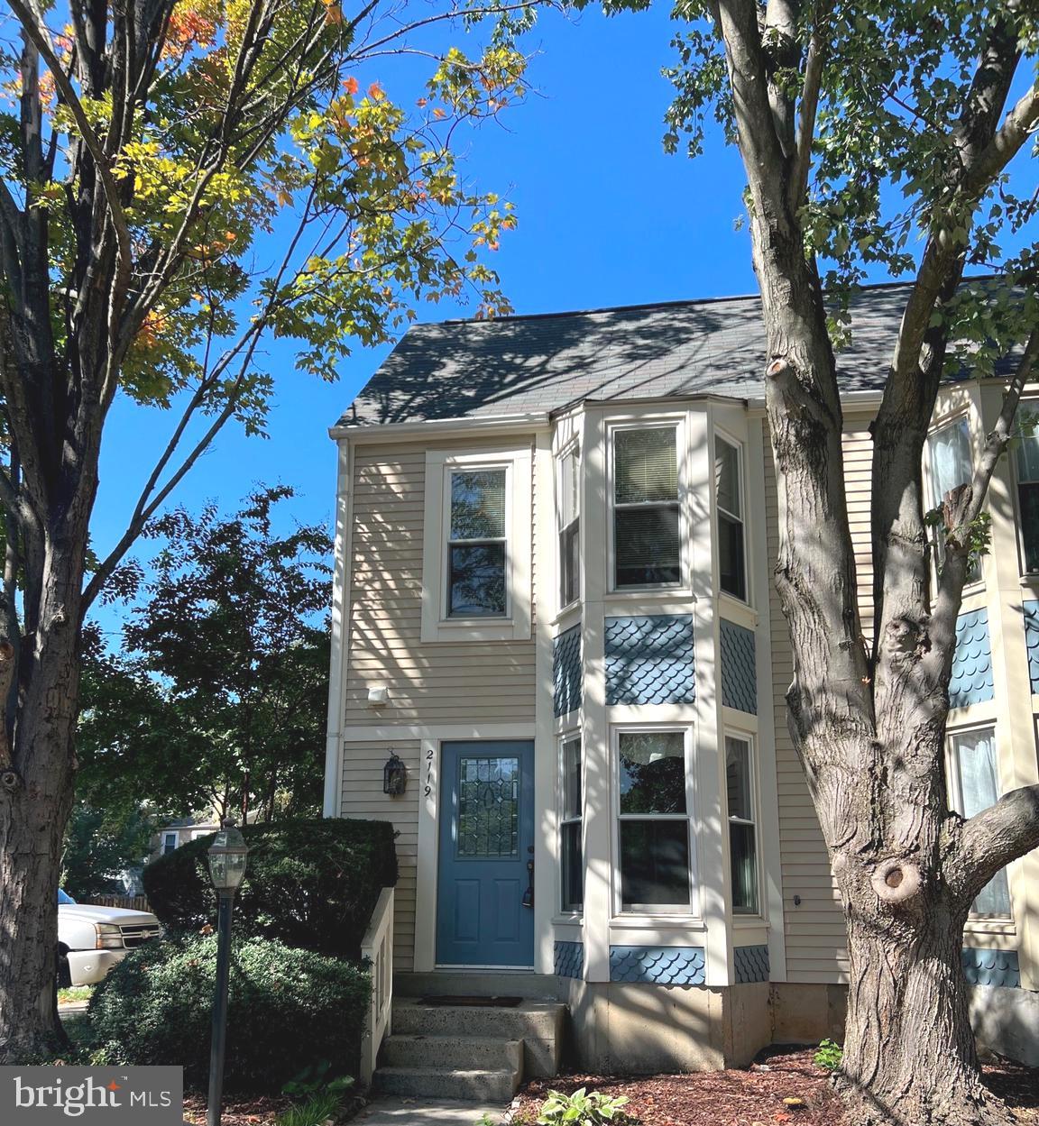 2119 Whisper Way Reston, VA 20191 - Photo 1 of 17 a front view of a house with a tree