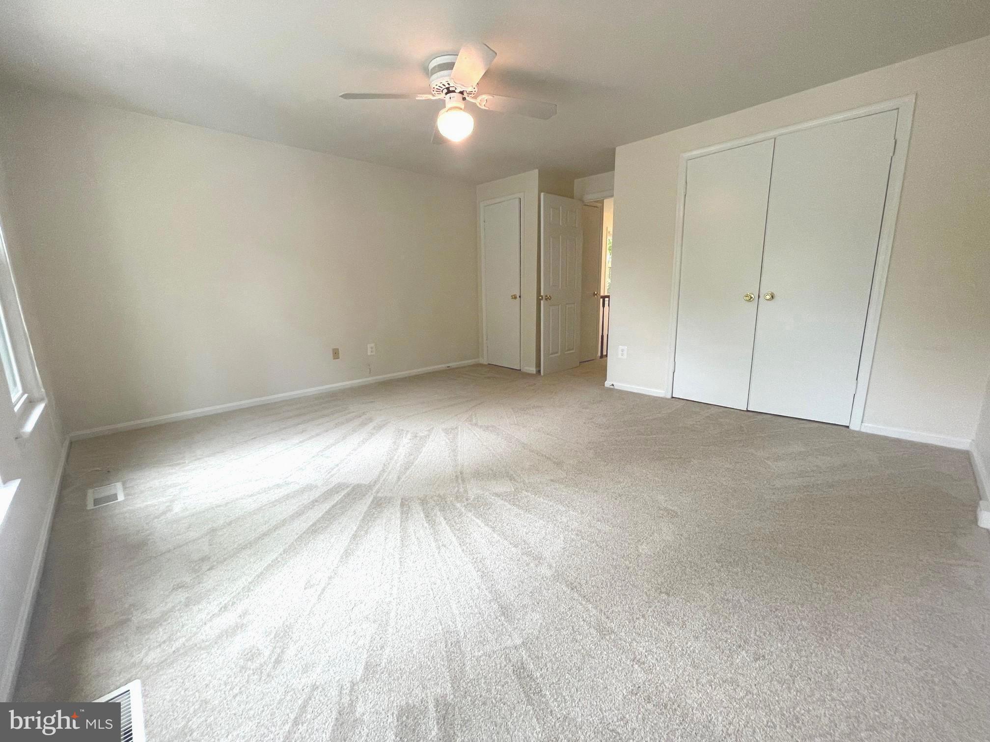 2119 Whisper Way Reston, VA 20191 - Photo 11 of 17 a view of empty room with wooden floor and fan