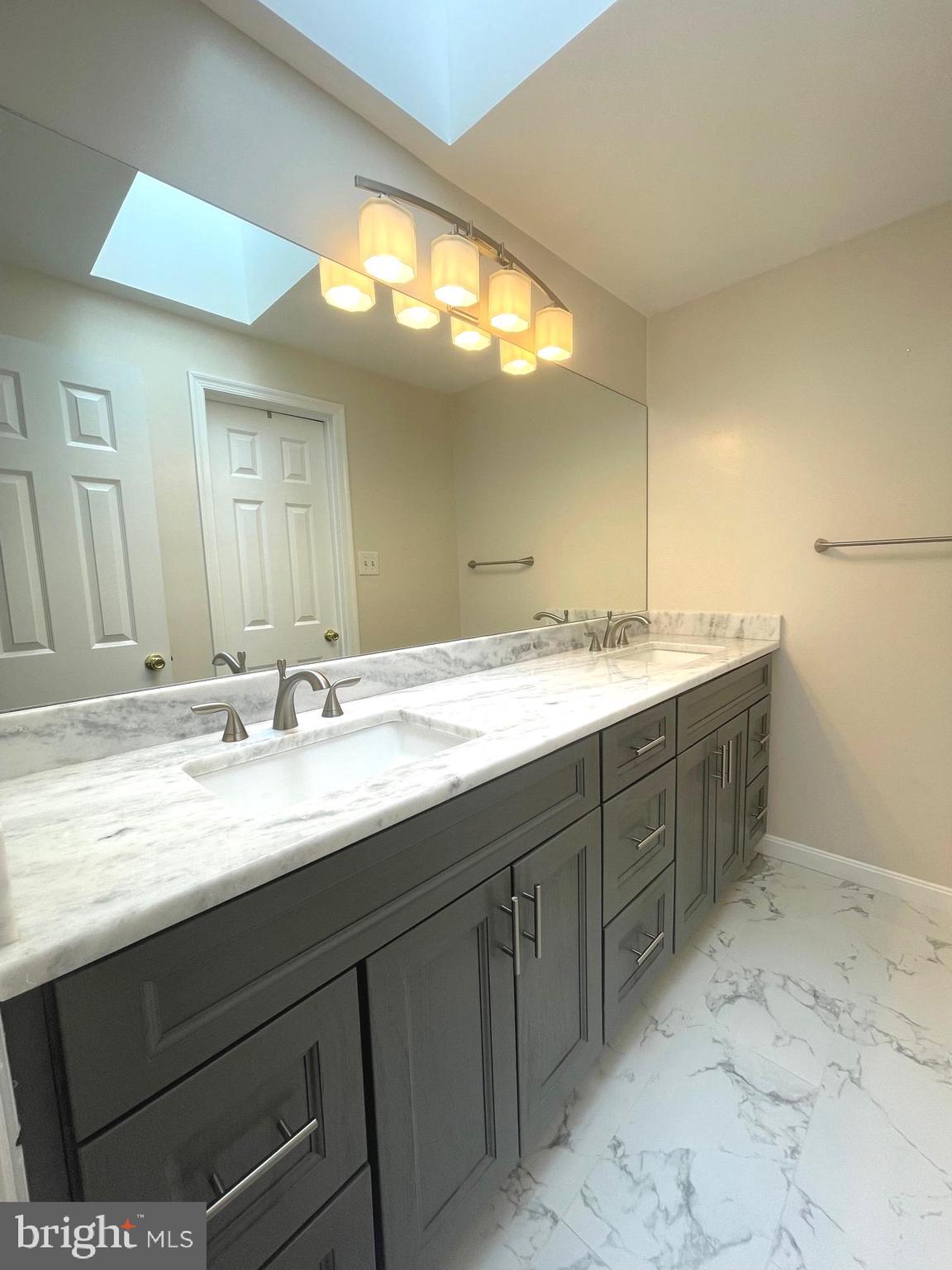 2119 Whisper Way Reston, VA 20191 - Photo 13 of 17 a bathroom with a double vanity sink and a mirror