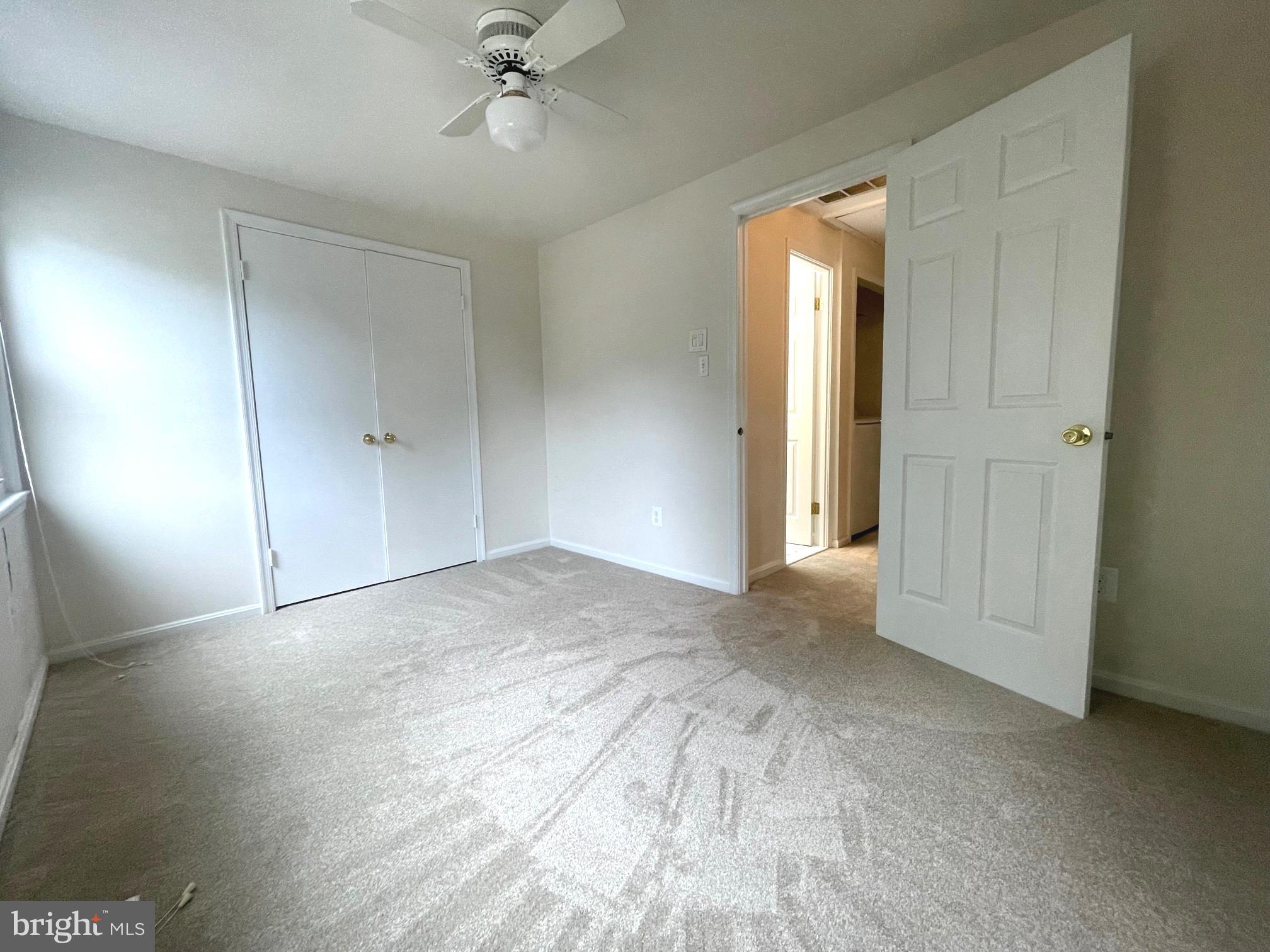 2119 Whisper Way Reston, VA 20191 - Photo 16 of 17 a view of a room with a ceiling fan and hardwood floor