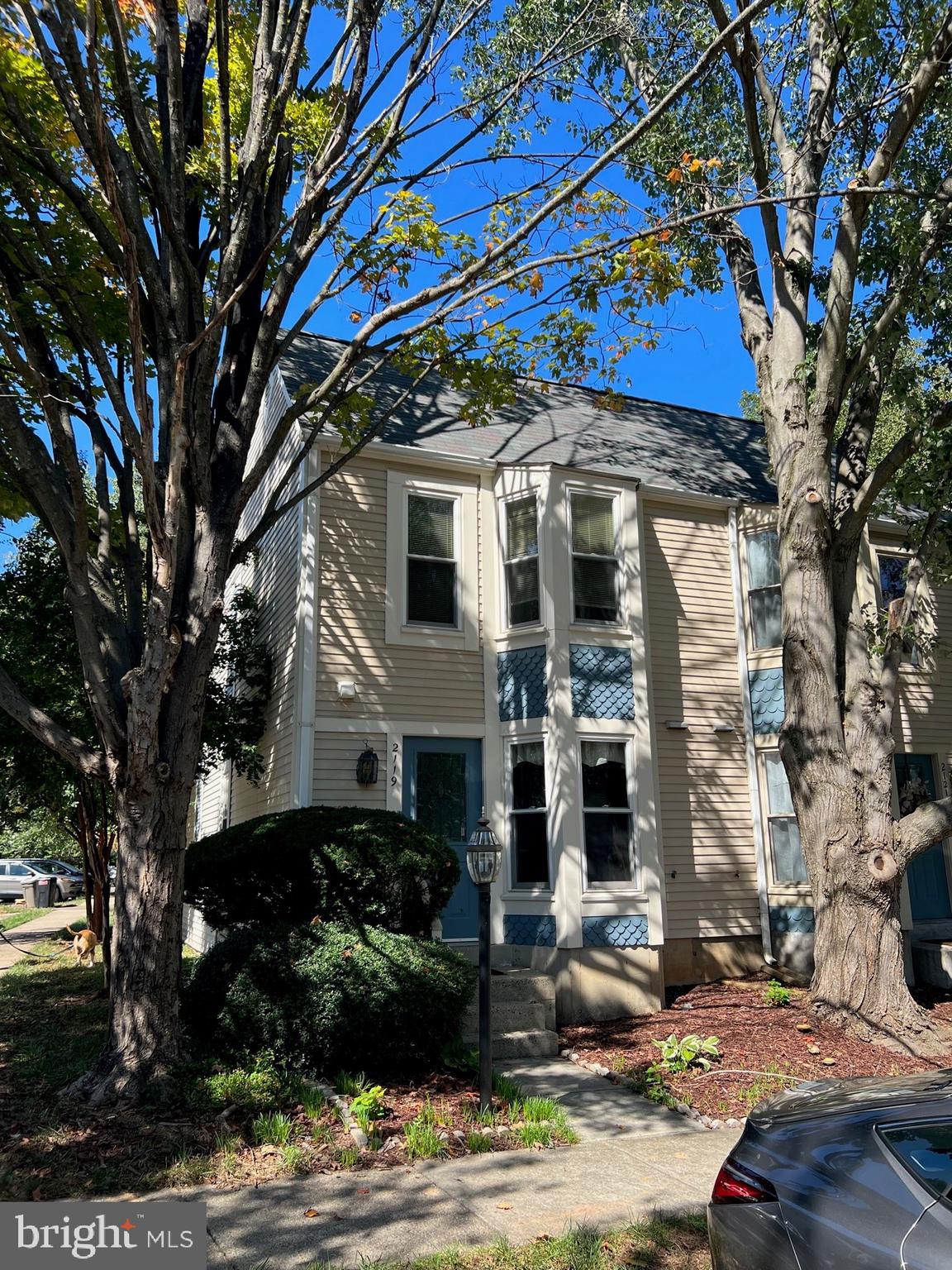 2119 Whisper Way Reston, VA 20191 - Photo 17 of 17 a front view of a house with a tree