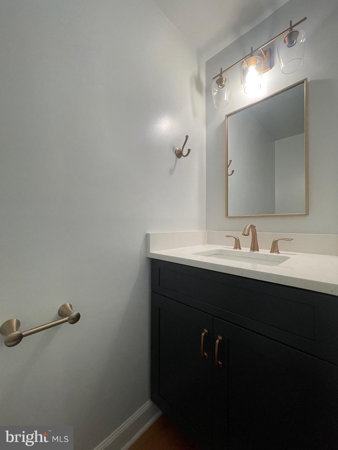 2119 Whisper Way Reston, VA 20191 - Photo 5 of 17 a bathroom with a sink and a mirror