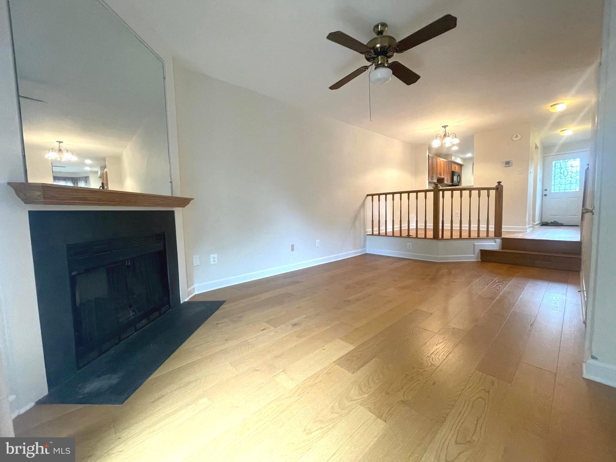2119 Whisper Way Reston, VA 20191 - Photo 7 of 17 a view of livingroom with hardwood floor and a ceiling fan