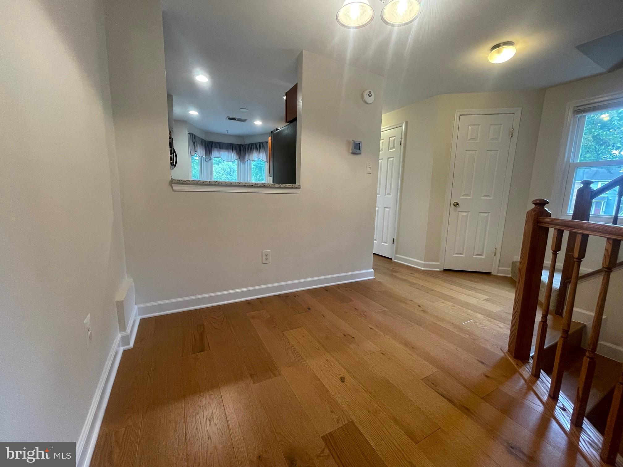 2119 Whisper Way Reston, VA 20191 - Photo 8 of 17 an entryway of a house with wooden floor and windows