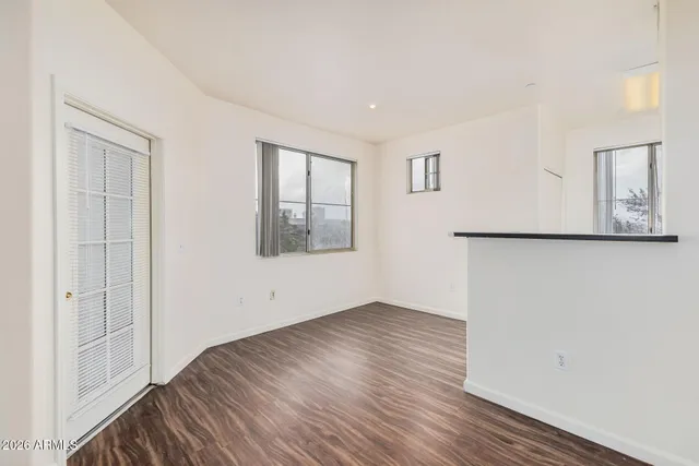 a kitchen with kitchen island a sink table and chairs