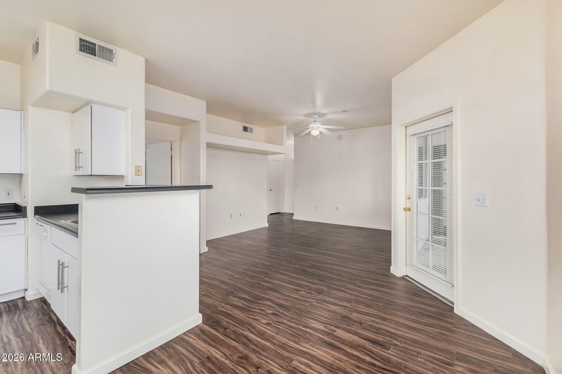 3302 North 7th Street, Unit 307 Phoenix, AZ 85014 - Photo 12 of 42 a view of a kitchen with wooden floor and a sink