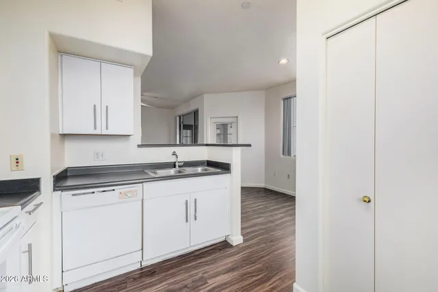 a view of an empty room with a chandelier