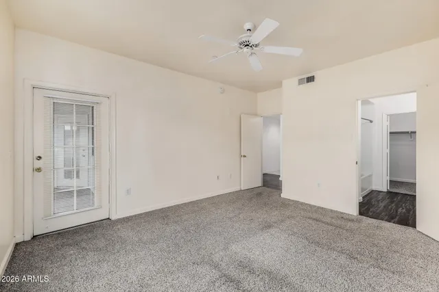 a white bath tub sitting next to a shower