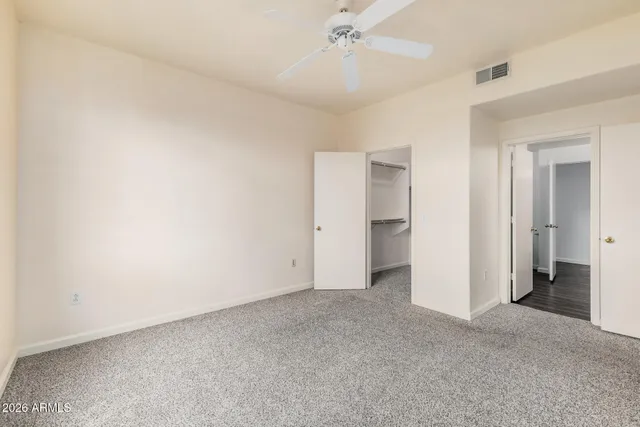 a white toilet and tub sitting next to a bathroom sink