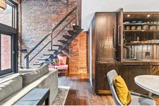 a view of living room with furniture and floor to ceiling window