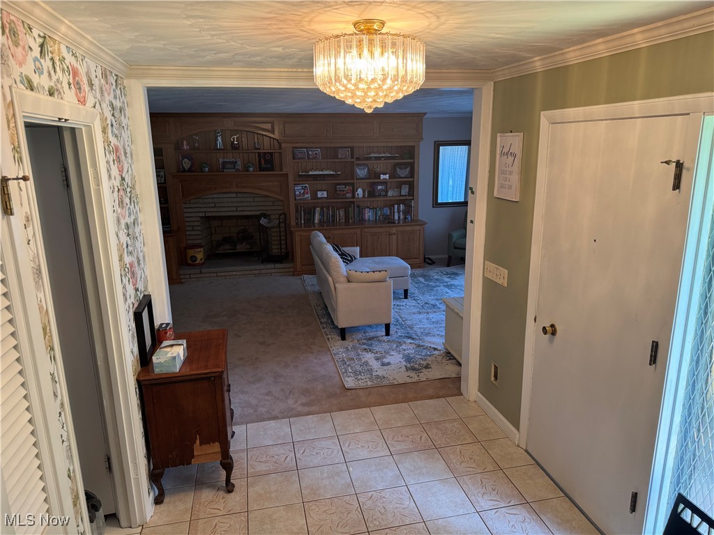 1452 Avalon Road Wooster, OH 44691 - Photo 30 of 31 Living area with a chandelier, a fireplace, light tile patterned floors, and light carpet
