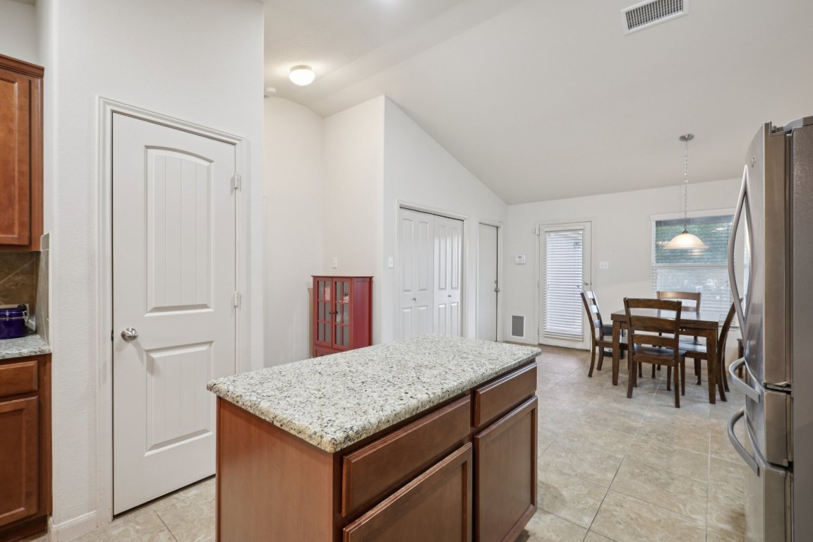 1621 Big Thicket Drive Cedar Park, TX 78613 - Photo 18 of 37 a kitchen with a table and chairs