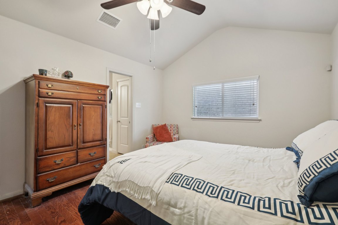 1621 Big Thicket Drive Cedar Park, TX 78613 - Photo 27 of 37 a bedroom with a bed and a dresser
