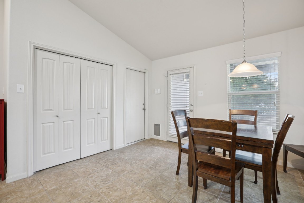 1621 Big Thicket Drive Cedar Park, TX 78613 - Photo 10 of 37 a view of a dining room with furniture and chandelier