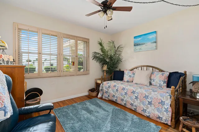 a bedroom with a bed and a couch