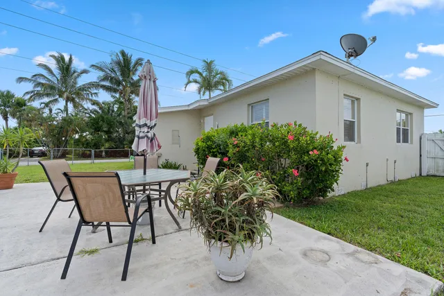 a view of a chairs and table in the patio