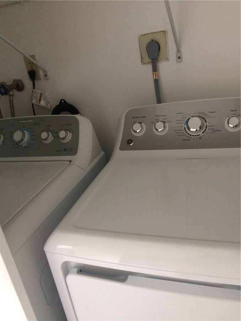 3571 Inverrary Drive, Unit 308 Lauderhill, FL 33319 - Photo 5 of 9 a utility room with dryer and washer