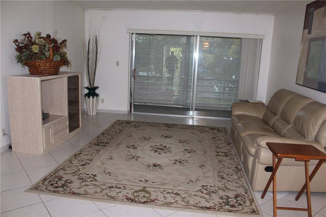 3571 Inverrary Drive, Unit 308 Lauderhill, FL 33319 - Photo 9 of 9 a living room with furniture