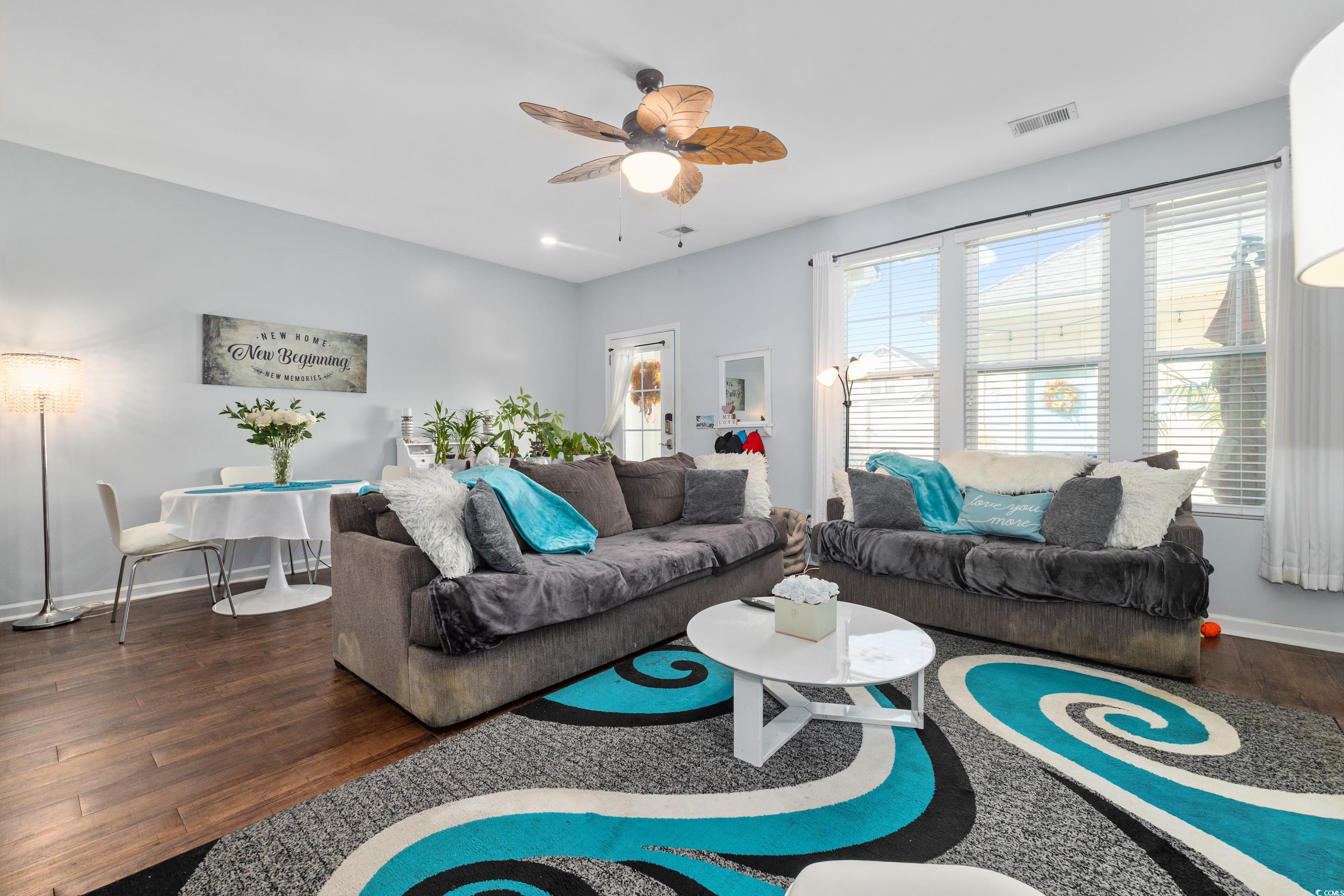 2360 Heritage Loop, Unit 2360 Myrtle Beach, SC 29577 - Photo 15 of 38 Living area featuring dark wood-style flooring and a ceiling fan