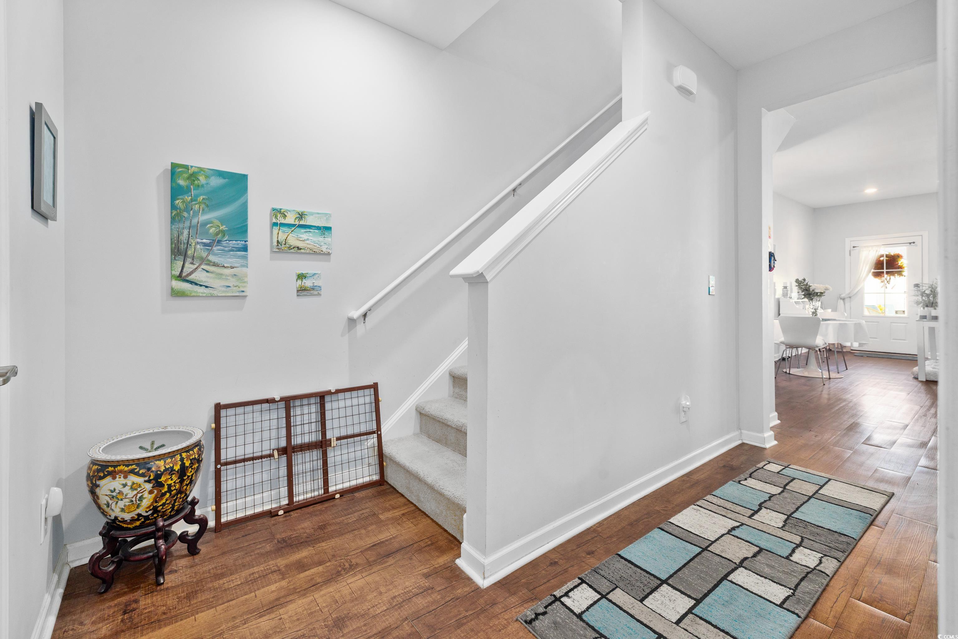 2360 Heritage Loop, Unit 2360 Myrtle Beach, SC 29577 - Photo 20 of 38 Staircase featuring wood finished floors and baseboards