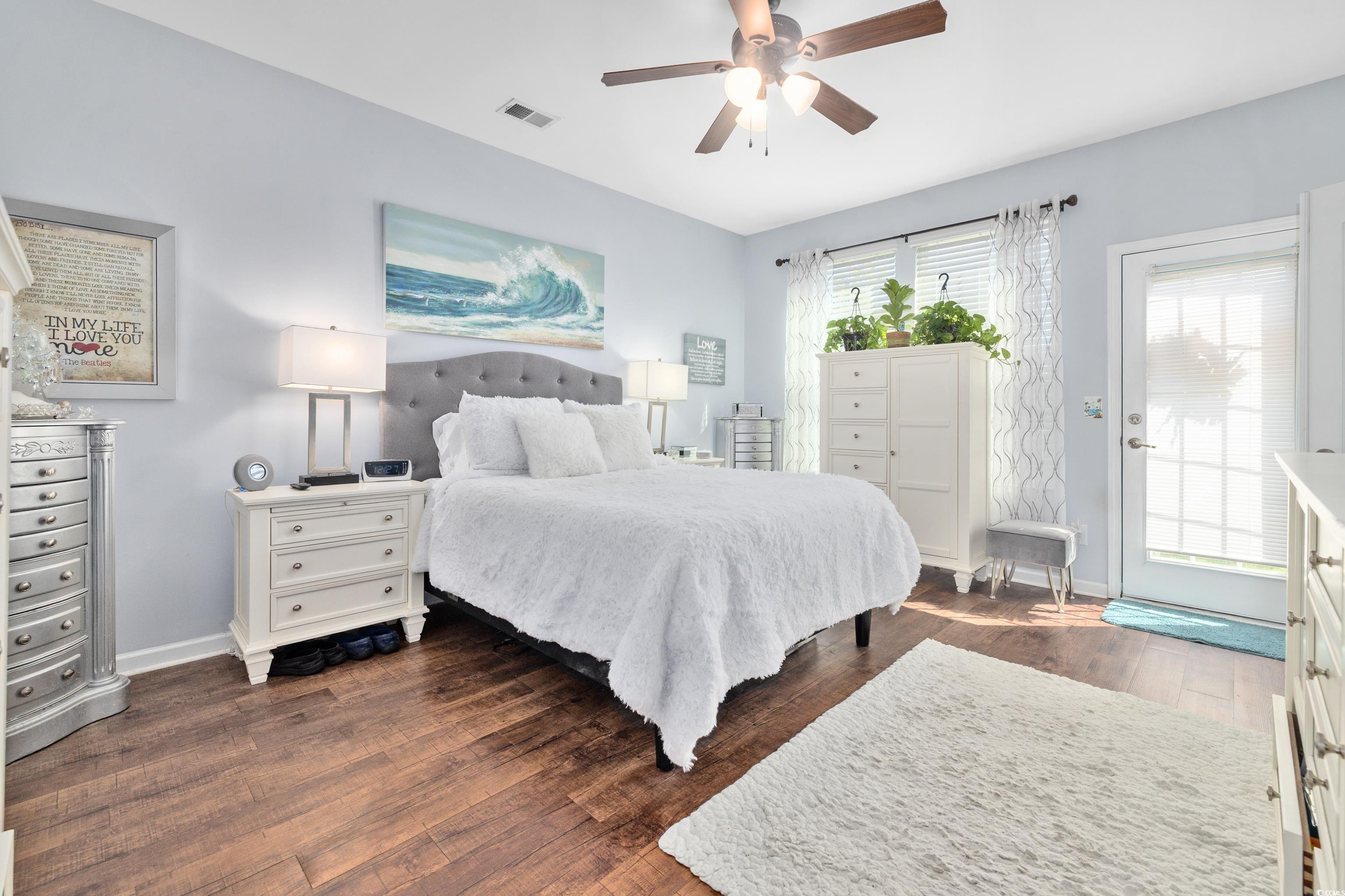 2360 Heritage Loop, Unit 2360 Myrtle Beach, SC 29577 - Photo 23 of 38 Bedroom featuring dark wood-style flooring, access to exterior, and ceiling fan