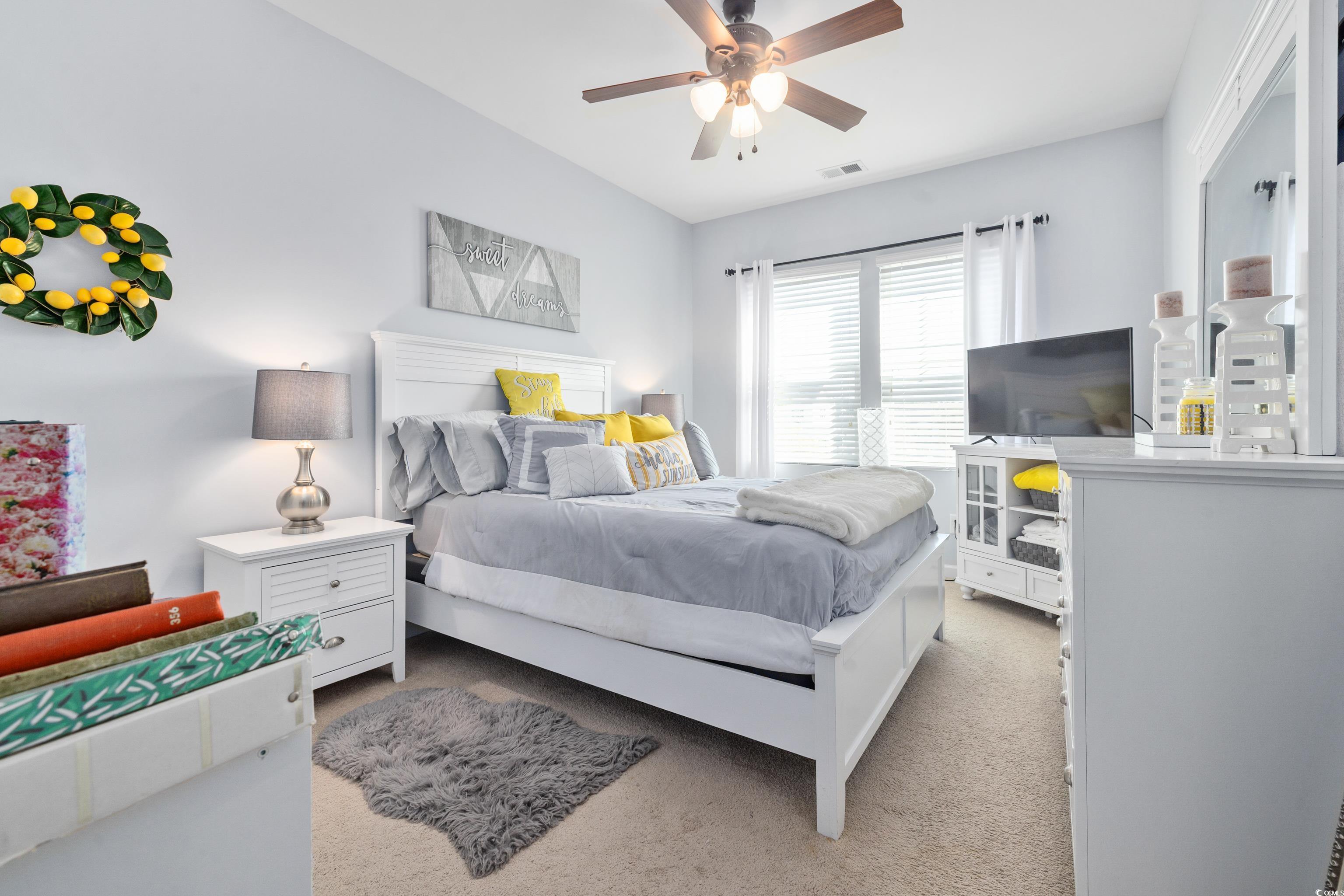 2360 Heritage Loop, Unit 2360 Myrtle Beach, SC 29577 - Photo 30 of 38 Bedroom with light colored carpet and ceiling fan