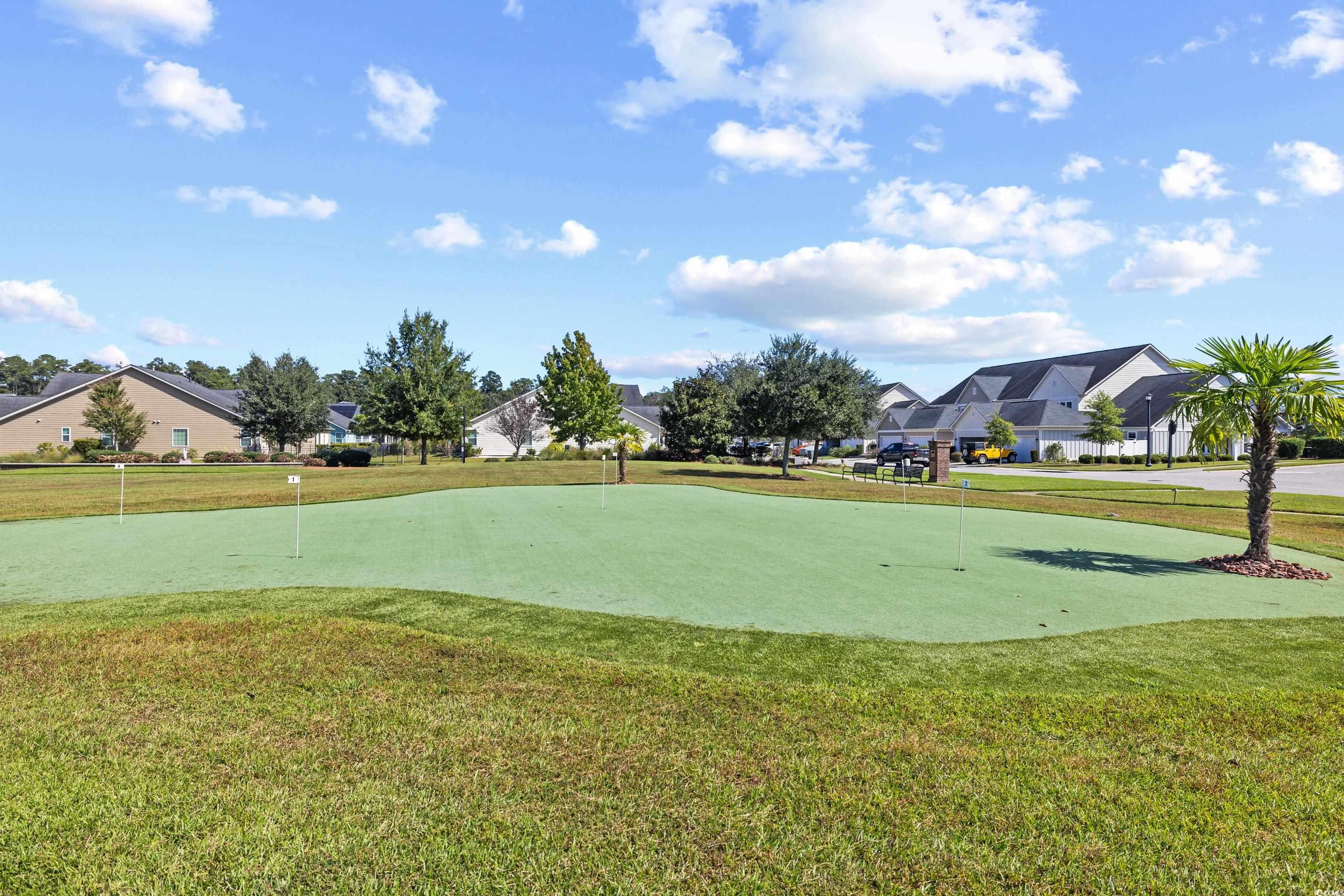 2360 Heritage Loop, Unit 2360 Myrtle Beach, SC 29577 - Photo 37 of 38 View of property's community featuring a lawn, a putting green, a residential view, and golf course view