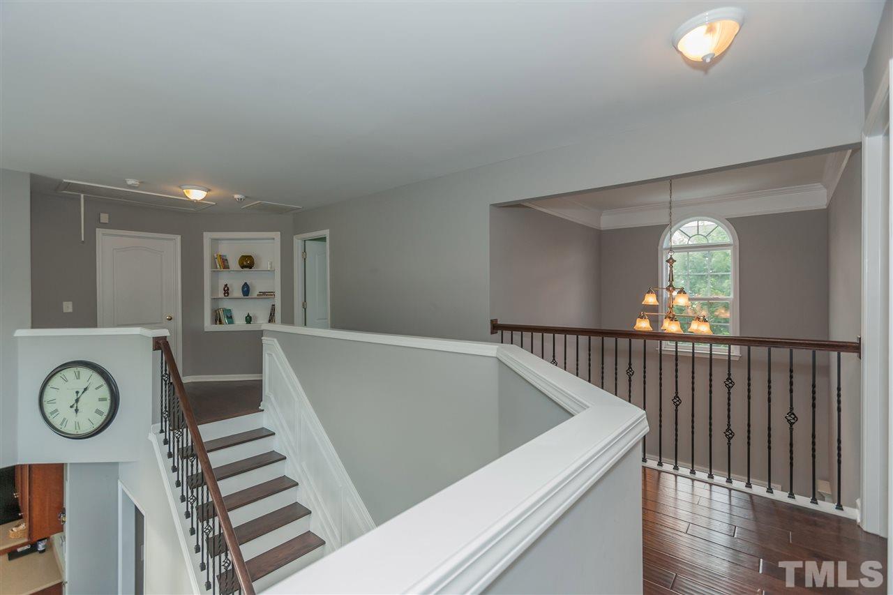 7613 Silver View Lane Raleigh, NC 27613 - Photo 12 of 25 The rich designer floors continue into the upstairs hallway.