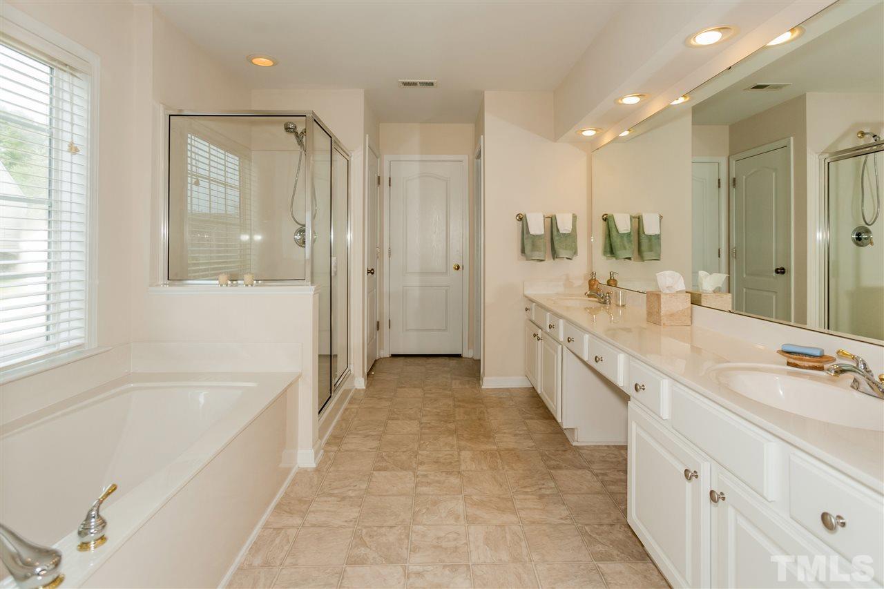 7613 Silver View Lane Raleigh, NC 27613 - Photo 15 of 25 The luxurious master bath features a huge garden tub, separate shower, and tons of counter space.