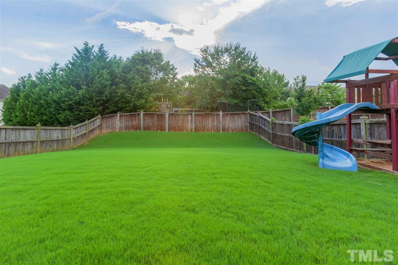 7613 Silver View Lane Raleigh, NC 27613 - Photo 21 of 25 Lush green grass and ample backyard space!