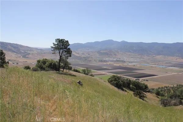 a view of a town with mountains in the background
