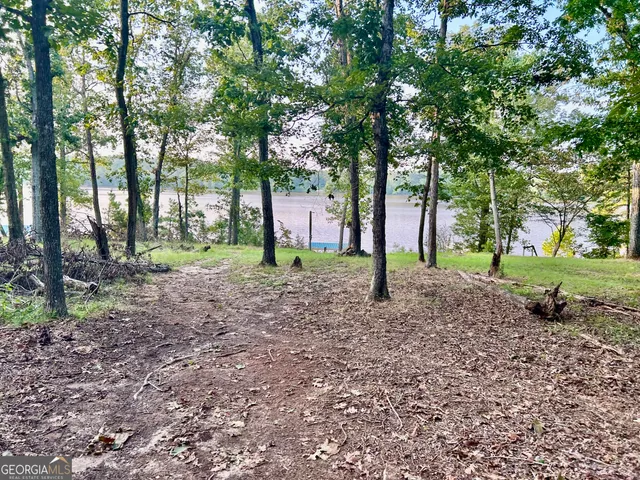 a view of a balcony with two chairs and a table