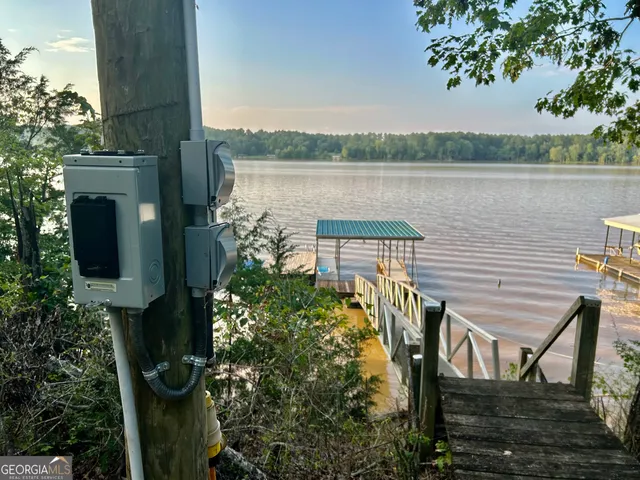 a kitchen with stainless steel appliances granite countertop a sink and a refrigerator