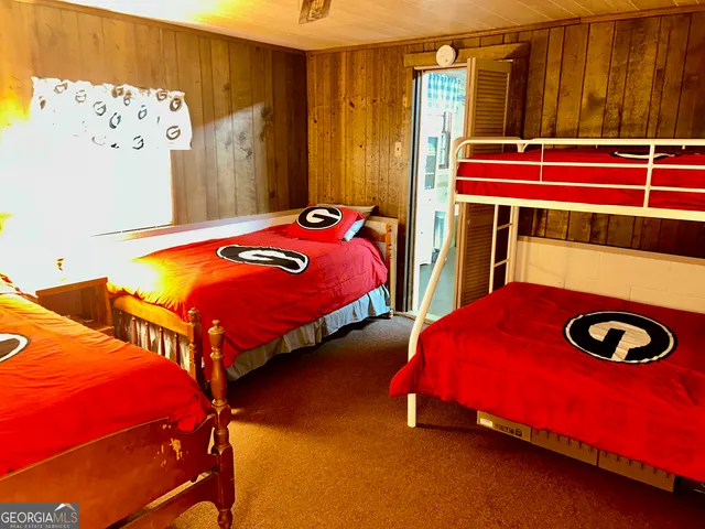 a bedroom with bed and walk in closet