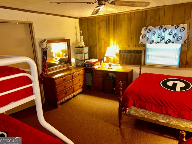 a bathroom with a toilet and a shower curtain