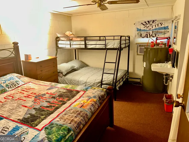 a living room with furniture and large windows