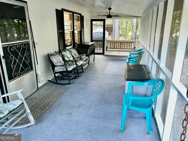 an aerial view of a house with yard