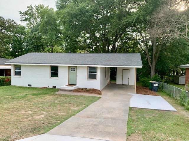 4559 Hendrix Drive Forest Park, GA 30297 - Photo 1 of 24 a front view of a house with a garden