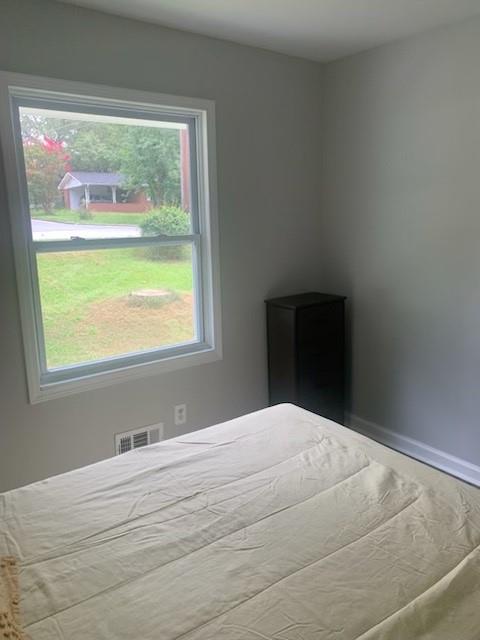 4559 Hendrix Drive Forest Park, GA 30297 - Photo 18 of 24 a bedroom with a bed and window