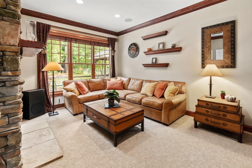 7 Pettees Pond Lane Walpole, MA 02081 - Photo 11 of 38 a living room with furniture and a window