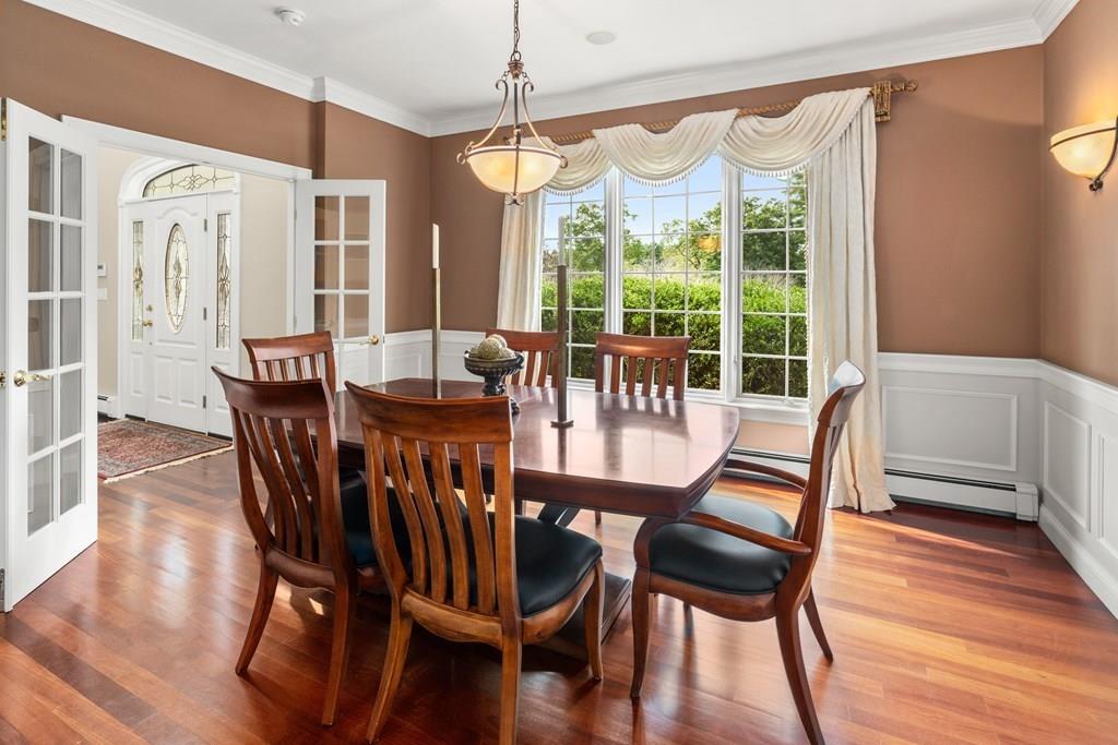 7 Pettees Pond Lane Walpole, MA 02081 - Photo 12 of 38 a view of a dining room with furniture window and wooden floor