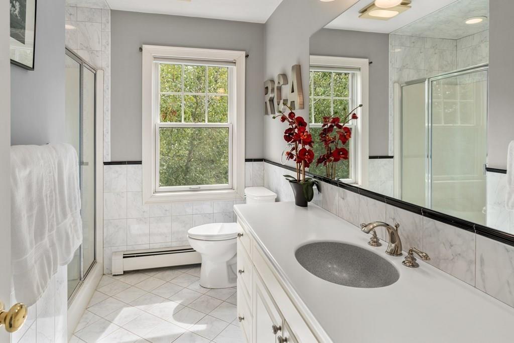 7 Pettees Pond Lane Walpole, MA 02081 - Photo 21 of 38 a bathroom with a sink toilet and a mirror